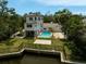 The backyard boasts a refreshing pool and convenient canal access, perfect for outdoor enjoyment at 4831 Primrose Path, Sarasota, FL 34242