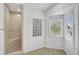 Tiled bathroom featuring natural stone shower, glass block window and corner windows at 4831 Primrose Path, Sarasota, FL 34242