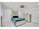 This bedroom features a modern color scheme, recessed lighting, and a large window at 4831 Primrose Path, Sarasota, FL 34242