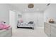 Bright bedroom with seahorse bedding, dresser, and a flamingo at 4831 Primrose Path, Sarasota, FL 34242