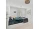 Bright bedroom features natural light and a plush, cozy bed with a pizza pillow at 4831 Primrose Path, Sarasota, FL 34242
