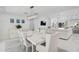 Bright dining area with contemporary furnishings and decor adjacent to living areas at 4831 Primrose Path, Sarasota, FL 34242