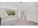 Bright, airy living room with wood floors and great natural light at 4831 Primrose Path, Sarasota, FL 34242