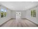 Bright living room with hardwood floors, natural light and neutral walls at 4831 Primrose Path, Sarasota, FL 34242