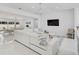 Bright, open-concept living room and dining area with stylish furnishings at 4831 Primrose Path, Sarasota, FL 34242