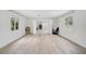 Spacious living room featuring hardwood floors, natural light and open floor plan at 4831 Primrose Path, Sarasota, FL 34242