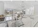 Bright living room has modern decor with views to the kitchen and pool at 4831 Primrose Path, Sarasota, FL 34242