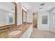 Main bathroom featuring double sinks, granite countertops and natural stone shower at 4831 Primrose Path, Sarasota, FL 34242