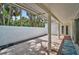 Inviting brick patio with palm tree view, perfect for outdoor relaxation and entertaining guests at 4831 Primrose Path, Sarasota, FL 34242