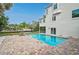 Inviting backyard pool with brick pavers and views of the home at 4831 Primrose Path, Sarasota, FL 34242