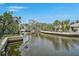Scenic waterfront view featuring lush landscaping and waterway access for a relaxing lifestyle at 4831 Primrose Path, Sarasota, FL 34242