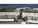 Discover the perfect condo layout from above, showcasing nearby parking and idyllic waterfront views at 4832 Independence Dr, Bradenton, FL 34210