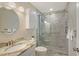 This modern bathroom features a glass-enclosed shower with a rain shower head at 4832 Independence Dr, Bradenton, FL 34210