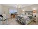 Comfortable bedroom with tile floors, a ceiling fan, and a great workspace at 4832 Independence Dr, Bradenton, FL 34210