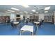 Game room with tables, chairs, and plenty of natural light at 4832 Independence Dr, Bradenton, FL 34210