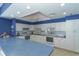 Clubhouse kitchen with white cabinetry, stainless appliances, and ample counter space at 4832 Independence Dr, Bradenton, FL 34210