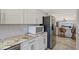 Bright kitchen boasts stainless steel appliances, granite counters and decorative backsplash at 4832 Independence Dr, Bradenton, FL 34210