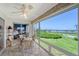 Enclosed lanai offers scenic views of the golf course, with a seating area for relaxing and enjoying the scenery at 4832 Independence Dr, Bradenton, FL 34210