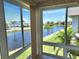 Bright living area features large windows with lovely views of the lake and landscaping at 4832 Independence Dr, Bradenton, FL 34210