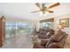 Cozy living room with sliding glass doors opening to a screened patio with water views at 4832 Independence Dr, Bradenton, FL 34210