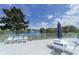 Outdoor patio with lake views, seating, and umbrellas at 4832 Independence Dr, Bradenton, FL 34210