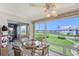Serene sunroom featuring views of the water and greenery at 4832 Independence Dr, Bradenton, FL 34210
