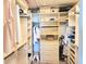 Organized walk-in closet with custom shelving and ample storage space for clothes and accessories at 4832 Independence Dr, Bradenton, FL 34210
