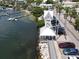 Scenic waterfront clock tower near marina, featuring docks, boats, and tropical palms on Anna Maria Island at 4832 Independence Dr, Bradenton, FL 34210