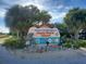 Welcome sign for Holmes Beach on Anna Maria Island surrounded by palm trees and lush landscaping at 4832 Independence Dr, Bradenton, FL 34210