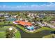 Aerial view of community clubhouse with pool, golf course, and tennis courts at 4907 Kilty E Ct, Bradenton, FL 34203