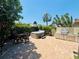 Beautifully landscaped backyard featuring a hot tub, dining area and outdoor kitchen perfect for entertaining at 4907 Kilty E Ct, Bradenton, FL 34203