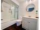 Bright bathroom features include a modern sink, a glass-door shower and nautical decor at 4907 Kilty E Ct, Bradenton, FL 34203