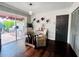 Dining area featuring dark wood floors and sliding doors to the outside porch at 4907 Kilty E Ct, Bradenton, FL 34203