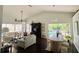 Bright living room boasts vaulted ceilings, tile floors, and an open floor plan perfect for entertaining or relaxing at 4907 Kilty E Ct, Bradenton, FL 34203