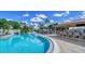 Outdoor pool area featuring a refreshing pool and an outdoor bar, perfect for relaxing and enjoying the community at 4907 Kilty E Ct, Bradenton, FL 34203
