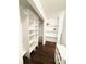 Well-organized walk-in closet with custom shelving and ample storage space for clothes and accessories at 4907 Kilty E Ct, Bradenton, FL 34203