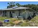 Exterior view of the rear of the property featuring a gray siding at 4959 Habana Dr, Sarasota, FL 34235