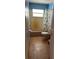 Bathroom with toilet, shower, and window at 4959 Habana Dr, Sarasota, FL 34235