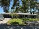 Single story home with a two-car garage and well-maintained lawn at 4959 Habana Dr, Sarasota, FL 34235