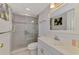 Clean bathroom featuring a glass enclosed shower, white sink, and light grey wall paint at 519 Albee Farm Rd # 212, Venice, FL 34285
