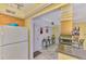 Eat-in kitchen with tile floors, white appliances, and plenty of counter space, plus a breakfast nook at 519 Albee Farm Rd # 212, Venice, FL 34285