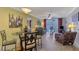 Inviting living space featuring a comfortable seating arrangement and access to the balcony at 519 Albee Farm Rd # 212, Venice, FL 34285