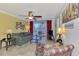 Comfortable living room with ceiling fan, seating, and access to a balcony with outdoor furniture at 519 Albee Farm Rd # 212, Venice, FL 34285
