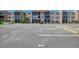 Exterior condo shot of complex showing the parking lot with reserved parking space at 519 Albee Farm Rd # 212, Venice, FL 34285