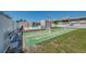 Enjoy a game of shuffleboard next to the community pool with guest seating and beautiful landscaping at 519 Albee Farm Rd # 212, Venice, FL 34285