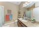 Well-lit bathroom featuring a vanity with granite counters and lots of storage space at 5307 65Th E Ter, Ellenton, FL 34222