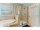 Clean, modern bathroom featuring a soaking tub and a glass enclosed shower at 5307 65Th E Ter, Ellenton, FL 34222