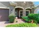 Charming home featuring a brick pathway, stone accents, lush landscaping, and a cozy, welcoming entrance at 5307 65Th E Ter, Ellenton, FL 34222