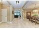 Spacious hallway with tile flooring, leads into an open living area with dining, and living room views at 5307 65Th E Ter, Ellenton, FL 34222
