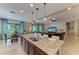 Spacious open kitchen with a granite island, stainless steel appliances, and plenty of natural light at 5307 65Th E Ter, Ellenton, FL 34222